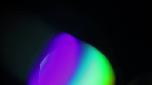 Colorful Light Patterns Morphing Against Black Background