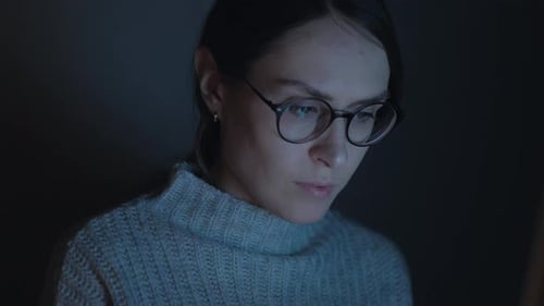 Attractive Female use smartphone at night. Close up. 4k.