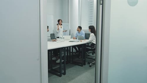 Business Meeting in Modern Office with Presentation