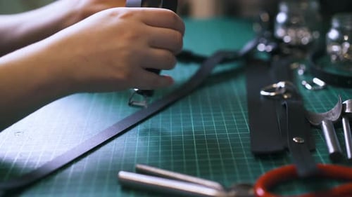Professional Tailor Makes Trendy Black Leather Garters