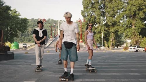 Group of Young Progressive Skaters in the City Park