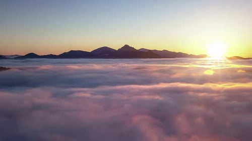 Aerial View Above Blue Clouds Nature at Beautiful Sunrise in Alpine Mountains Landscape