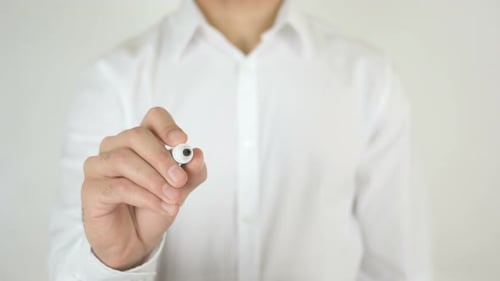 Hand Writes Profit on Clear Surface Close Up