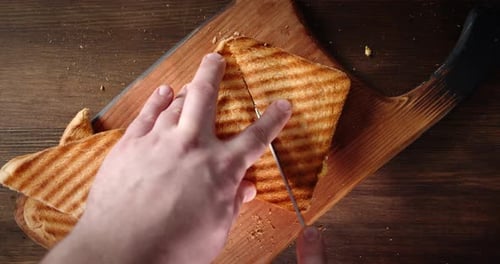 Cutting a Grilled Cheese Sandwich Into Triangles