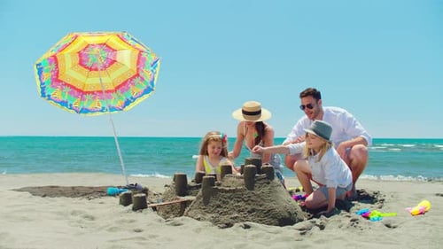Family spending time together on beach