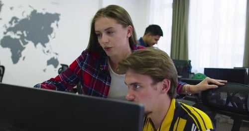 Concentrated Male Businessman Looking at Computer Monitor Working at Startup Office