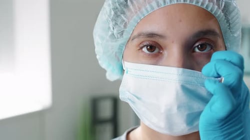 Health Care Worker Wearing Surgical Cap and Mask