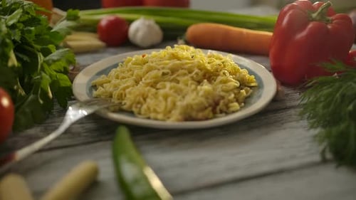 Noodles with Fresh Vegetables on Wooden Surface