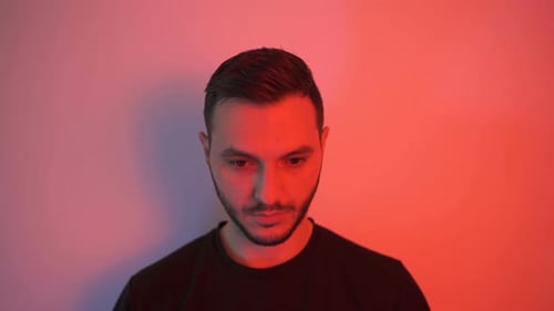 Man Putting On A Black Face Mask