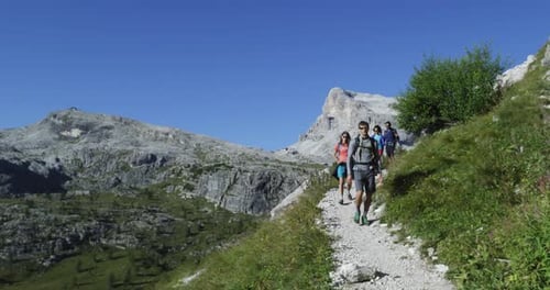 Four Friends Walking Along Hiking Trail Path