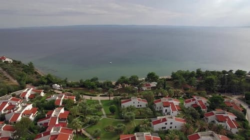 Resort Area with Cottages on the Coast of Vast Blue Sea, Aerial