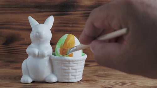 Painting Colorful Easter Egg with Brush