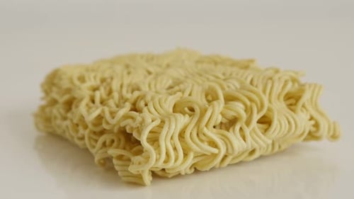 Instant staple food block 4K 2160p 30fps UltraHD tilting footage - Chinese type noodles close-up s