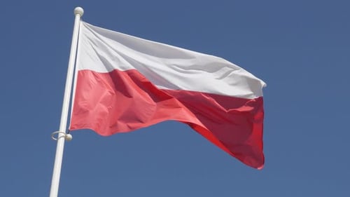Flag Waving Against Clear Blue Sky