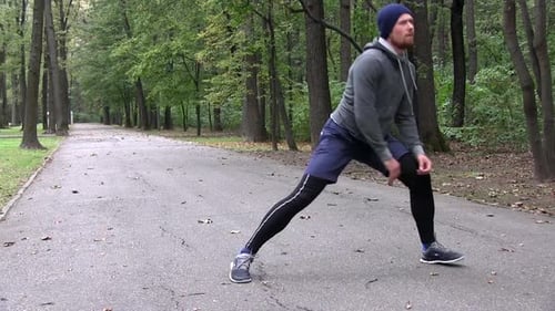 Athletic Man With A Red Beard Training Fitness At Woods