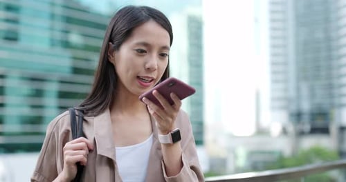 Woman Using Smartphone in an Urban Environment