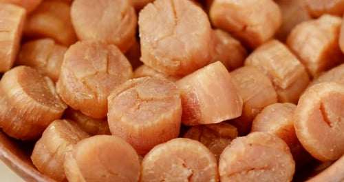 Bowl of Fresh Orange Scallops Close Up