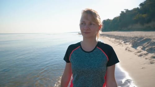 Barefoot Woman Walking on Beach