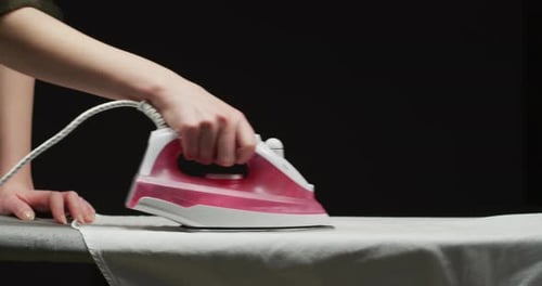 Woman ironing a shirt