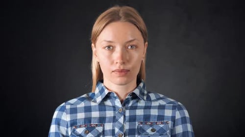Woman Smiling, Close Up on Dark Background