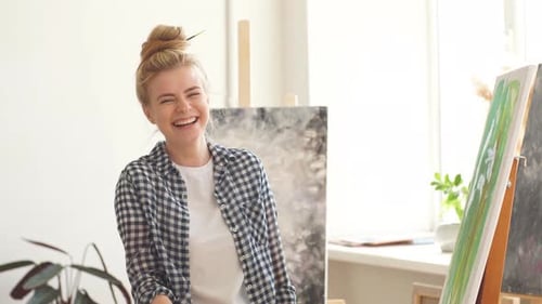 Blond Girl Working with Spatula in the Art Studio
