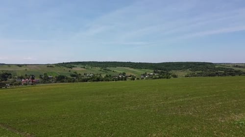 Aerial drone view of a flying over the rural agricultural landscape.