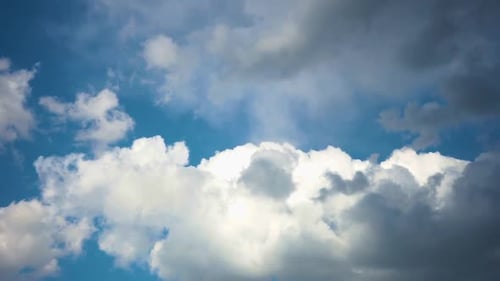 Clouds Drifting Across a Blue Sky on Sunny Day