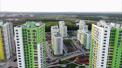 Bird's Eye View Modern Multistorey Buildings Bright Facades Near Forest