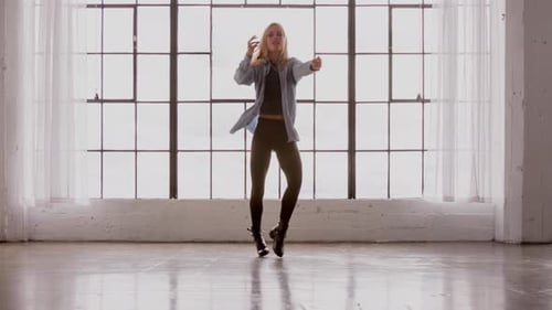 Woman Dancing in Studio With Large Window