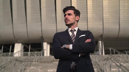 Young businessman with crossed arms