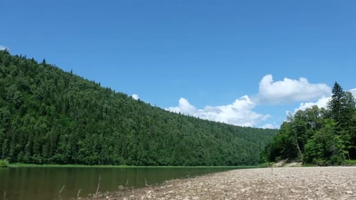 Movement of Clouds Over a River