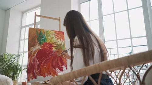 Woman Painting Colorful Abstract Art at Home