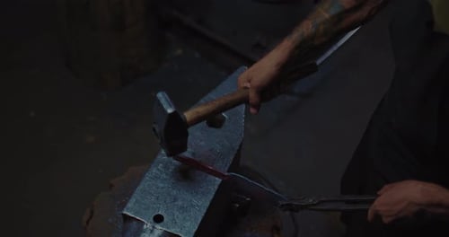 Blacksmith is Working with Hammer and Anvil in Workshop Handmade Craft Closeup View Prores