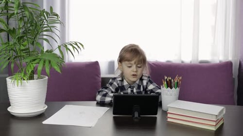Child Using Tablet for Education at Home