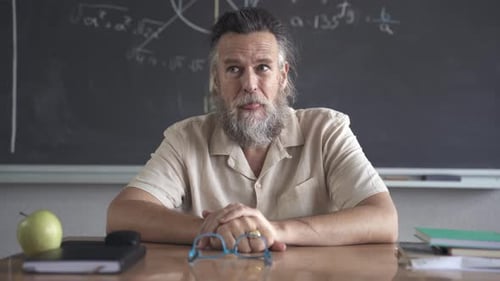 Teacher Explains Math Concepts in a Classroom