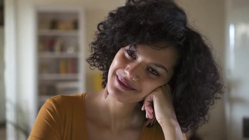 Close Up of Smiling Woman Resting Head on Hand