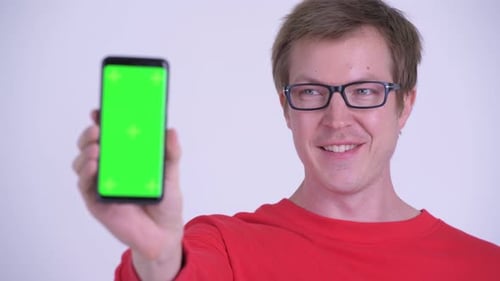 Man Holding Up Phone with Chroma Key Green Screen