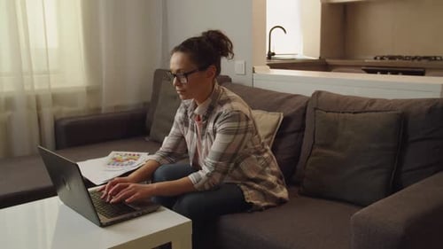 Woman Working on Laptop, Gets Headache at Home