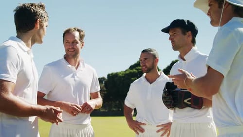 Cricket players into team discussion during cricket match
