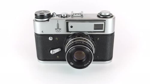 Film Soviet Rangefinder Camera On A White Background.