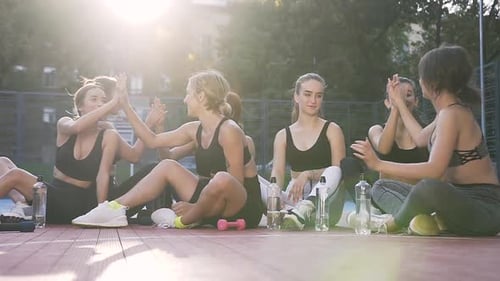 Fit Women Cheering and Celebrating Workout Success