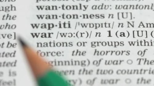 Definition of War Highlighted in Dictionary with Pencil