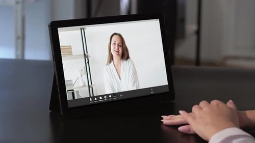 Woman on Tablet Video Call Speaking and Gesturing