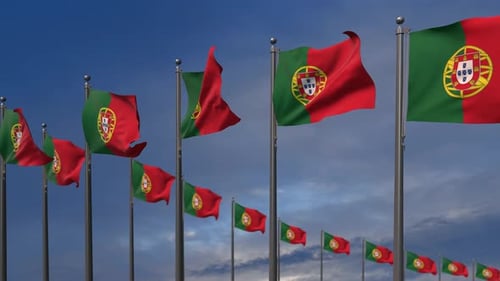 Portuguese Flags Waving Against a Blue Sky