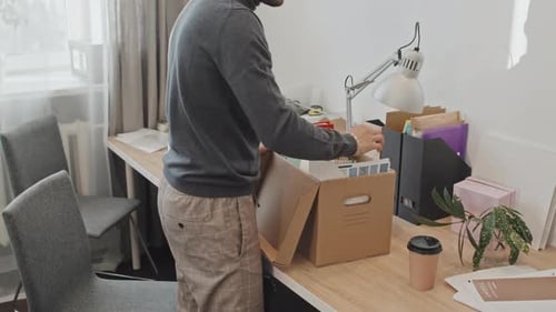 Man with Personal Belongings in Box Leaving Office
