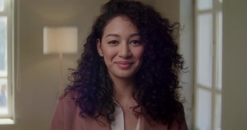 Smiling Mixed Race Young Woman Looking to Camera on Home Office with Happy Emotion Enjoying