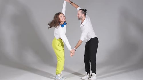 Dance Duo Performing Partner Routine in Studio