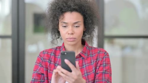 Woman Reacting to Bad News on Smartphone