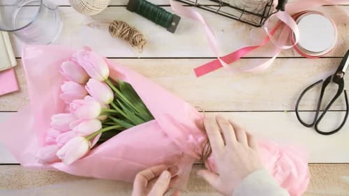 Pink Tulips Tied With Twine on Wood Table