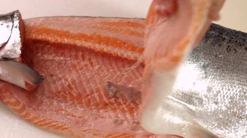 Man's Hands Take Fish Meat.